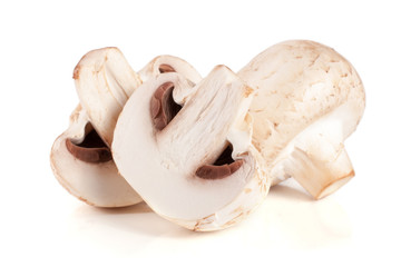 champignon mushrooms and half isolated on white background