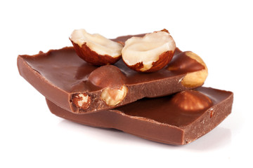 Chocolate with hazelnuts isolated on white background