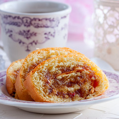 Roll with apple jam and nuts, selective focus, square