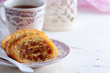 Sliced sweet roll with jam and peanuts, horizontal, copy space