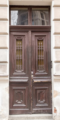 The vintage design brown  wooden front door of an old house