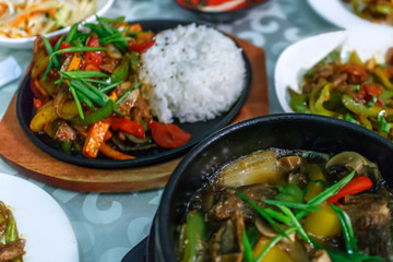 bibimbap in a heated stone bowl, korean dish