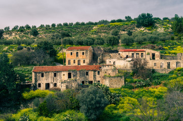 Fototapeta premium what is left from deserted houses in an abandoned village in Crete.