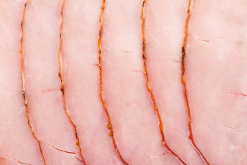 slices of smoked pork fillet pink texture background
