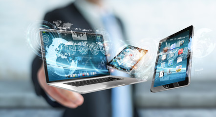 Businessman connecting tech devices to each other 3D rendering