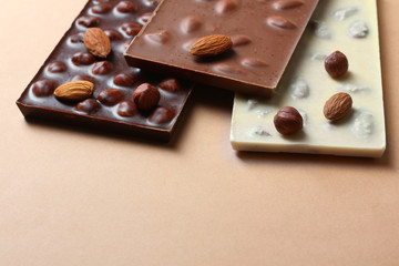 Black chocolate with hazelnuts, white and milk chocolate with almonds