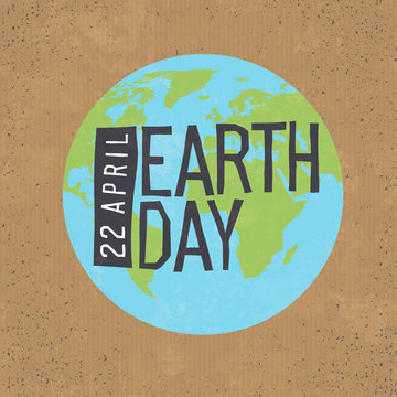 Earth day, 22 April text with globe symbol on cardboard  texture background.