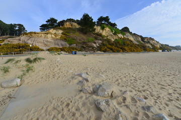 Branksome Chine beach at Bournemouth in Dorset on a spring morning, light cloud occasional sunshine.
