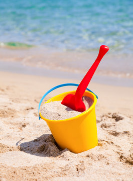 Yellow Sand Pail And Shovel On A Beach