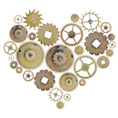 heart shape symbol from old brass gears isolated on white