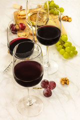 Glasses of red and white wine at tasting