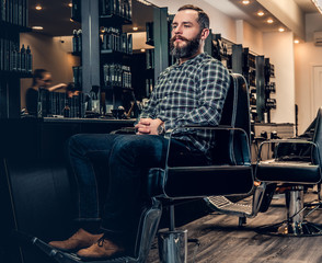 Fototapeta na wymiar Portrait of handsome casual male in a barbershop.