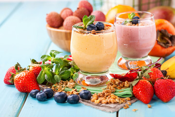 Orange persimmon blueberry smoothie   and fruits. Selective focus. Copy space. Top view