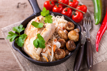 Chicken fillet, cabbage and mushrooms lunch. Selective focus. Copy space.