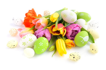 Easter eggs with tulips flowers on white background