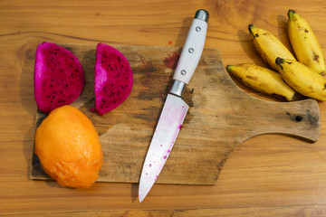 Asian fruit on wood background