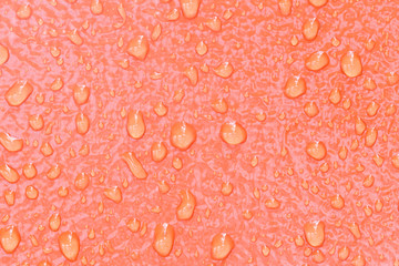 waterdrop on orange steel texture
