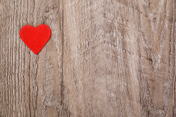 Red heart on wood rustic background. Concept for romantic love. Valentines day design. Wooden grunge board.