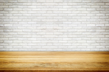 wooden shelves on brick concrete wal