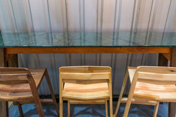 Modern wooden chair with green marble counter