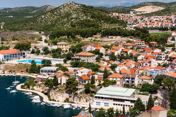 Birds view of the bay of adriatic resort Shibenic. Yachts in harbor and red roofs of houses, of old mediterranean town.