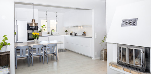 panorama of a fancy open interior kitchen in the background