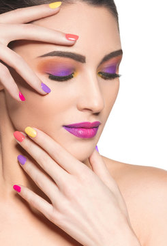 Beautiful  woman with multicolor nails and fashion makeup