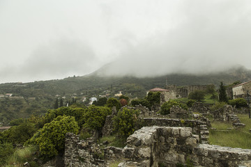 Fototapeta premium Montenegro The city of Old Bar. Low clouds sat on the tops of mountains, promising a quick downpour. All of nature grew silent and settled down to the storm.