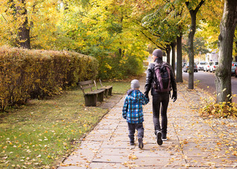 Father and child walking the street