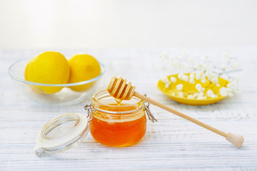 Still life with honey and lemons, healthy organic food