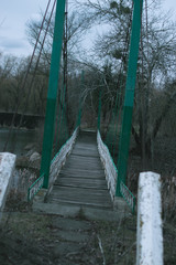 Old bridge over the river in the Ukrainian village