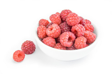 Raspberries in a bowl isolated on white background cutout