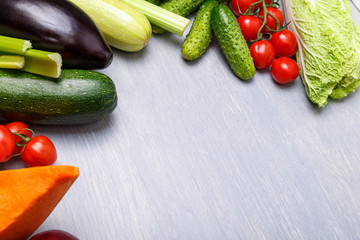 Vegetables. Tomato, cucumber and Chinese cabbage. Squash, zucchini and eggplant. Celery and pumpkin. Organic food on wooden table.