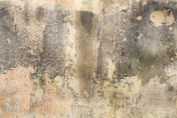 old grungy plastered wall with peeling color
