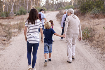 Obraz premium Multi Generation Family On Hike Through Countryside