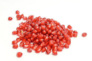 Scattered pomegranate seeds isolated on white background cutout