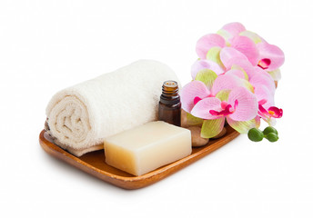 Spa set with organic soap, essential oil,soft towel and orchid flower isolated on white