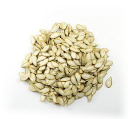 Heap of pumpkin seeds isolated on white background