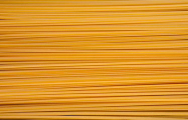 Pile of bavette pasta lying on flat surface