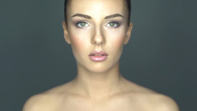 Beautiful young woman face close-up. Healthcare and skin treatment concept.