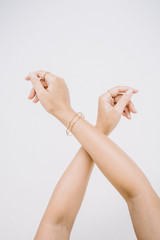 Woman hands with ring and bracelet.
