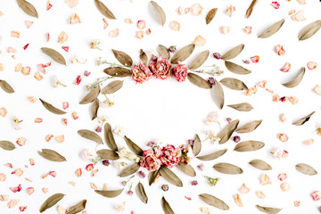 Round frame wreath pattern with roses, pink flower buds, branches and dried leaves isolated on white background. Flat lay, top view. Flower mockup background