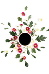 Coffee cup and wildflowers composition on white background. Flat lay, top view. Flowers composition.