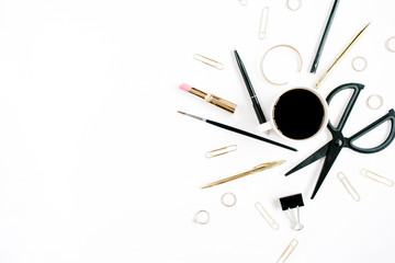 Home office workspace with coffee cup, scissors, clips and female accessories. Flat lay, top view