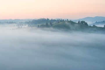 Foggy sunrise in the mountains