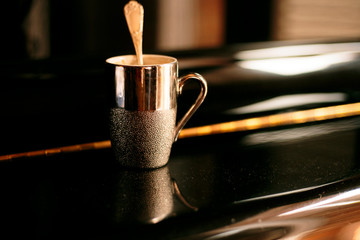 a coffee on a piano