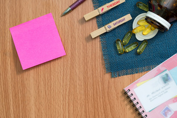 healthy diet days concept,Fish oil capsules with omega 3 and vitamin D on wooden background.