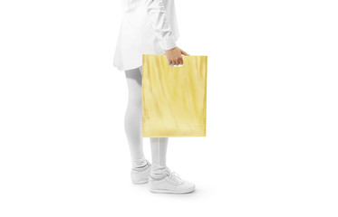 Blank yellow plastic bag mockup holding hand. Woman hold clear carrier sac mock up. Plain bagful branding template. Shopping carry package in persons arm. Promotional packet for logotype branding.