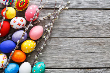 Colorful easter eggs on wood background