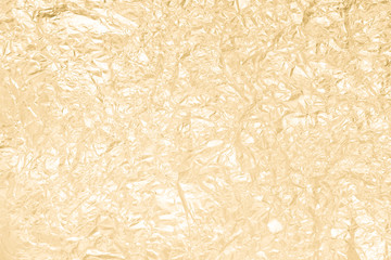 Gold wrinkled paper texture abstract background